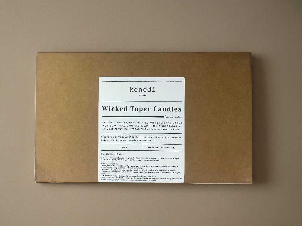 Kenedi Wicked Taper Candles packaging on a beige background