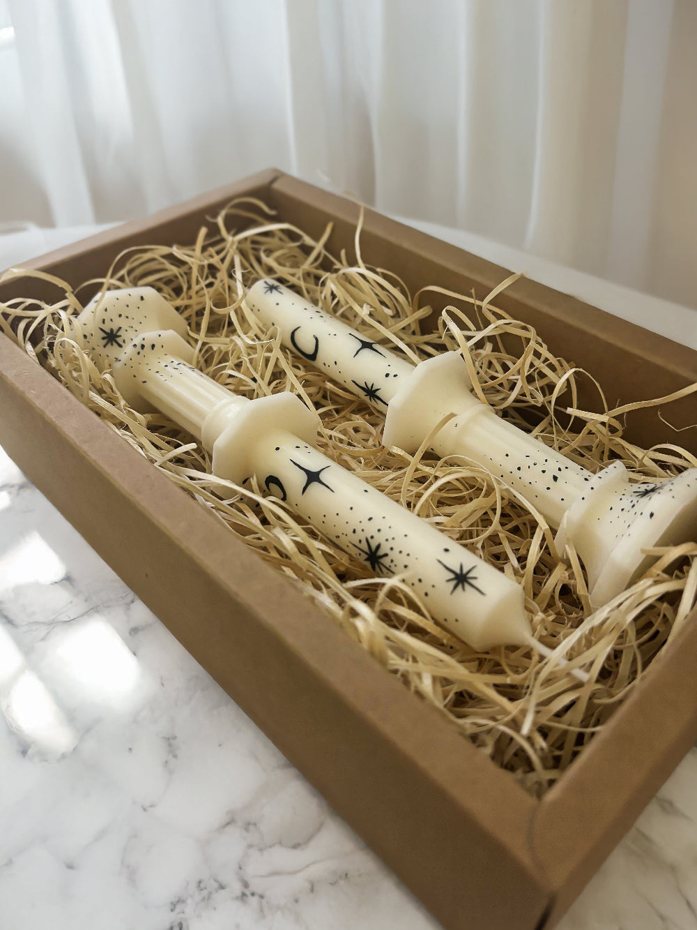 Two hand painted taper candles with a witchy vibe